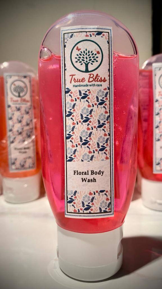 TrueBliss Floral Body Wash in pink bottle on display