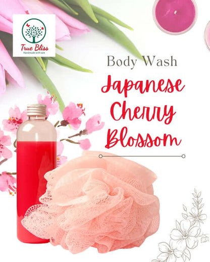 TrueBliss Japanese Cherry Blossom body wash with pink loofah and cherry blossoms.