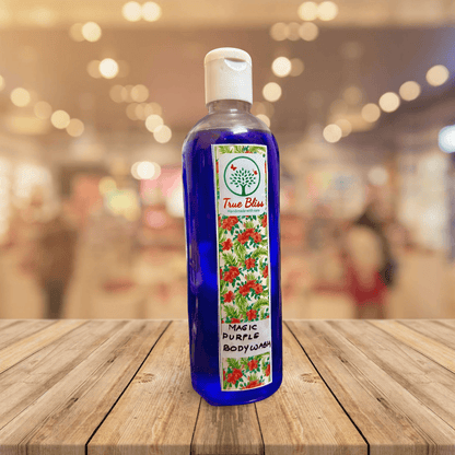 TrueBliss Magic Purple Body Wash bottle on a wooden surface with a bokeh background